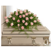 Pink roses arranged on a white casket