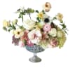Mixed pastel flower arrangement in a silver pedestal vase