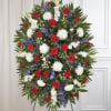 A striking red, white, and blue standing spray designed to honor a