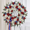 A striking red, white, and blue wreath designed to honor a cherished
