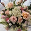 Bouquet of blush roses, white hydrangeas, and pink lisianthus