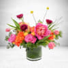 This gorgeous peony and ranunculus arrangement is perfect for adding a touch