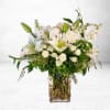 The Ivory Cascade arrangement radiates timeless grace with its elegant display of
