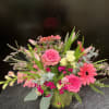 Pink and coral mixed bouquet in a glass vase