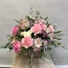 Pink roses and carnations with pale alstroemeria in a vase