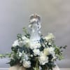Bouquet will be delivered approximately as pictured. Features a musical box angel