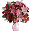 This bouquet blends the passionate red roses, vibrant hot pink carnations, and