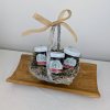 Gift basket with three jam jars on a wooden tray