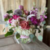Pink and white mixed bouquet in a clear glass vase