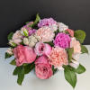 Pink and peach rose bouquet with carnations and small filler flowers