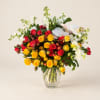Bouquet of red and yellow roses with white orchids in a glass vase