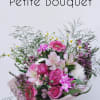 A mix of  pink flowers with silver dollar, hand-tied and wrapped.