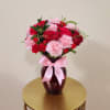 Carnations, roses, greens, rucus and mini carnations means a mix of blooms