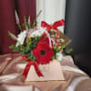 A stylish arrangement featuring a mix of the freshest blooms, elegantly presented