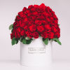Large dome of red roses in a white hatbox