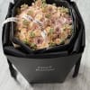 Bouquet of blush and peach roses in a black gift box