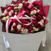 This enchanting bouquet features a captivating blend of delicate spray roses and
