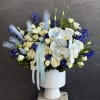 A graceful blend of blue and white blooms, thoughtfully designed to bring