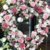 The "Whispering White &amp; Pink Spray" features a delicate mix of pink