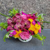 Immerse yourself in the brilliance of our Scarlet Sunset arrangement, where vibrant