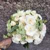 Delicate spray roses come together in a symphony of beauty and grace.