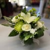 White lily and rose bouquet with green accents