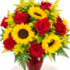 Bouquet of red roses and yellow sunflowers in a red vase