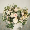 Large bouquet of pale pink and white roses with mixed white blooms
