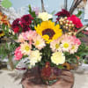 6 inch detailed resin turkey planter, filled with seasonal blooms.  Perfect