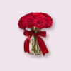 Vibrant red roses arranged in a lush, full bouquet, tied with a