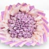 Bouquet of lavender roses wrapped in pink and purple paper