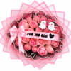 Pink rose bouquet with a satin bow and cartoon ghost toppers