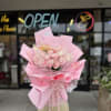 Pink rose bouquet wrapped in layered pink paper