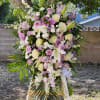 Lavender Funeral flower Spray arrangement filled with roses and many more beautiful