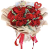 Bouquet of red roses with a birthday topper and heart decoration