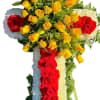 Cross-shaped floral spray with red and yellow roses and white chrysanthemums