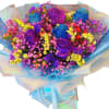 Bouquet of multicolored roses and small filler flowers wrapped in blue paper