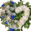 Heart-shaped bouquet of white, silver, and blue roses with baby's breath