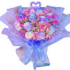 Bouquet of pastel roses with pink filler flowers and purple wrapping