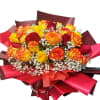 Bouquet of red and yellow roses with white baby's breath in red wrap