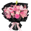 Pink bouquet with lilies, roses, and carnations wrapped in black paper