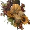 Autumn arrangement with pumpkins, sunflowers, and dried foliage