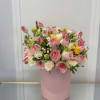 Pink and white rose bouquet in a pink cylindrical box