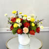 Layers of red, coral, and golden blooms come together in a rich