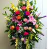 Tall mixed floral spray with pink lilies and roses