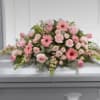 Pink floral casket spray with gerbera daisies and roses