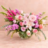 Pink and lavender mixed bouquet in a clear glass vase