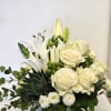 A pristine arrangement of white roses, exuding timeless elegance and pure beauty.