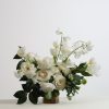 White floral arrangement in a low glass vase