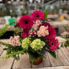 Gerbera daisies and hydrangeas are the highlight of this bountiful bouquet!
